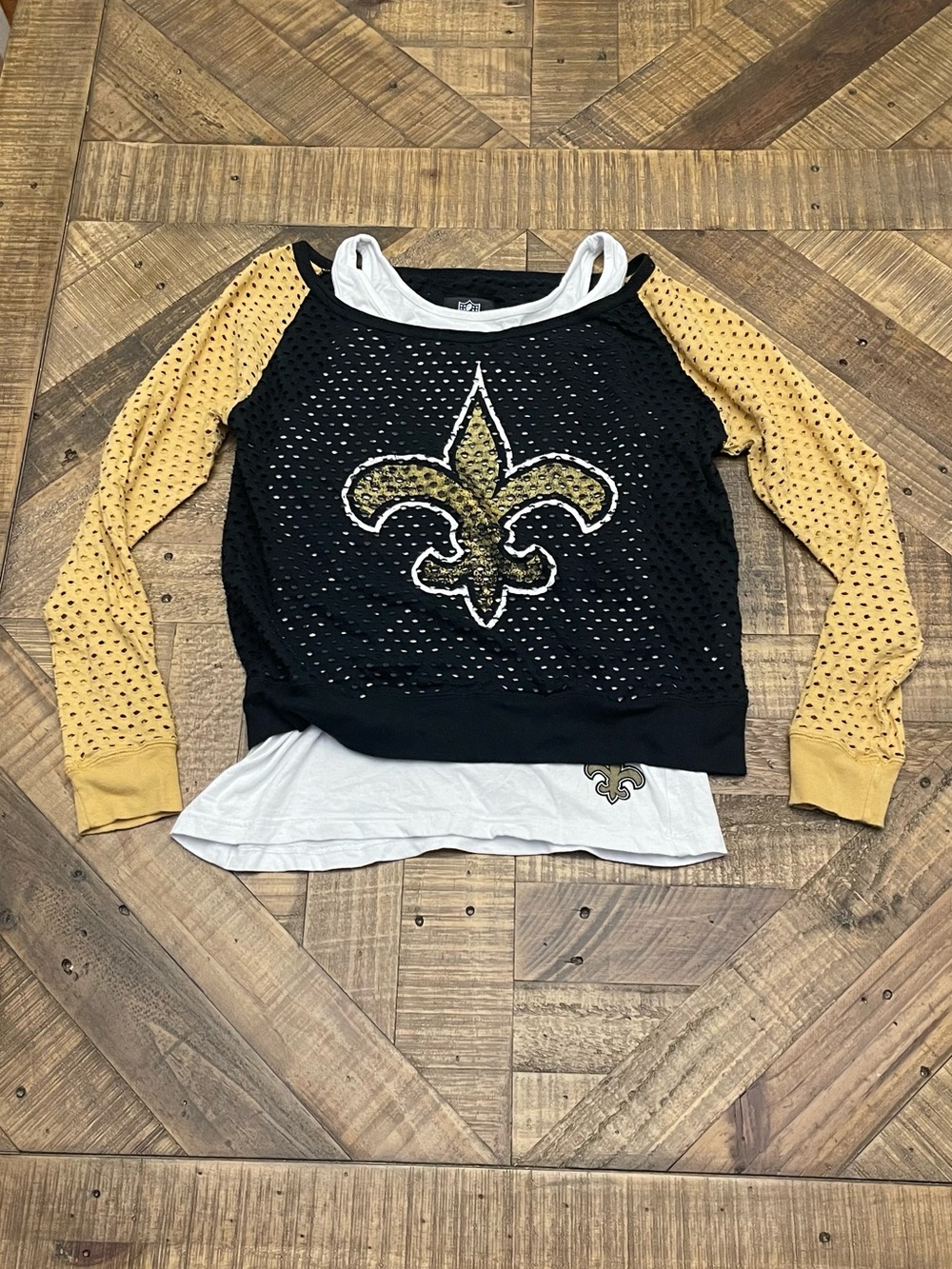 women's New Orleans Saints layered top, featuring a black fishnet/mesh overlay